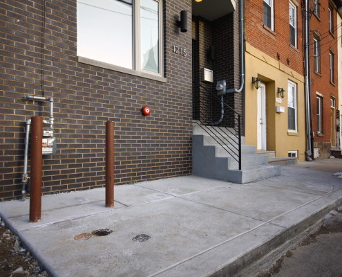 Brick-front-Concrete-Sidewalk and Steps Philadlphia Concrete sidewalk and steps in Philadelphia by M&C Contractors