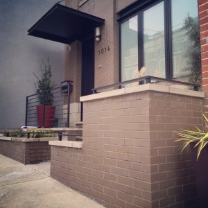 Brown brick with limestone top and a custom design was done on this Philadelphia home